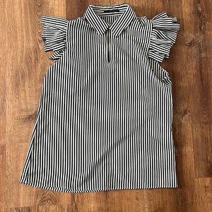 Loose fitted blouse with ruffled shoulders, rarely worn